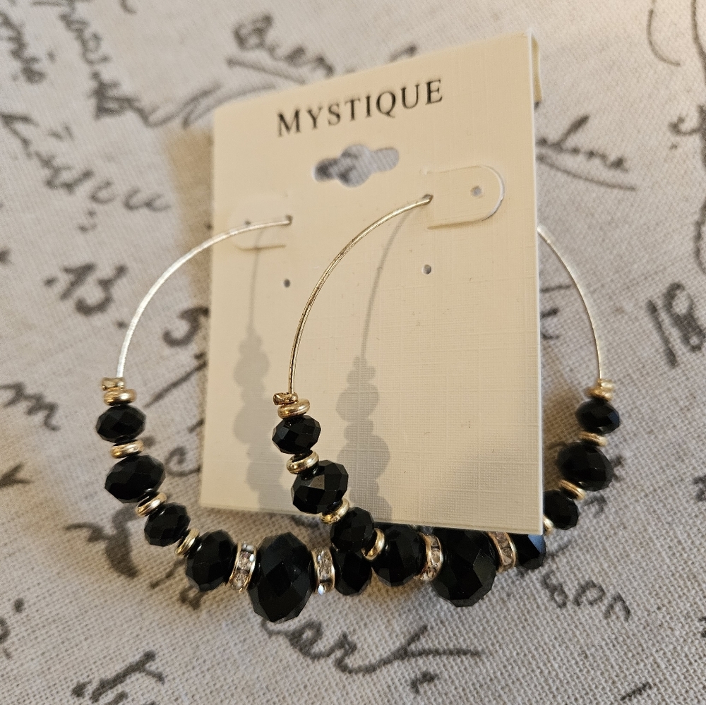 Mystique gold tone and black stone hoop earrings